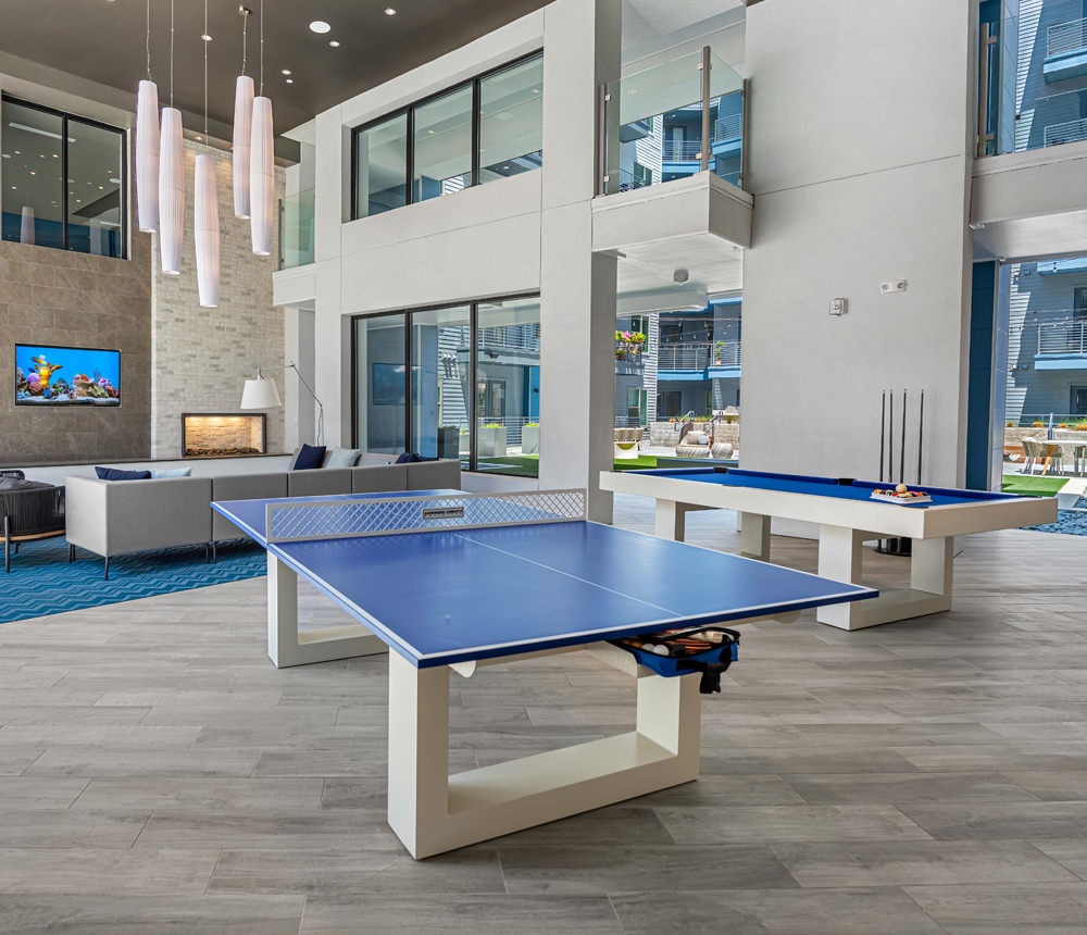 ping pong and billiards tables in spacious, two-story clubhouse